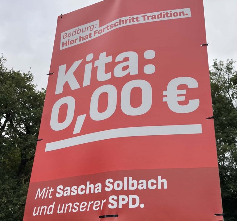 Plakat der SPD Bedburg mit weißer Schrift auf rotem Hintergrund